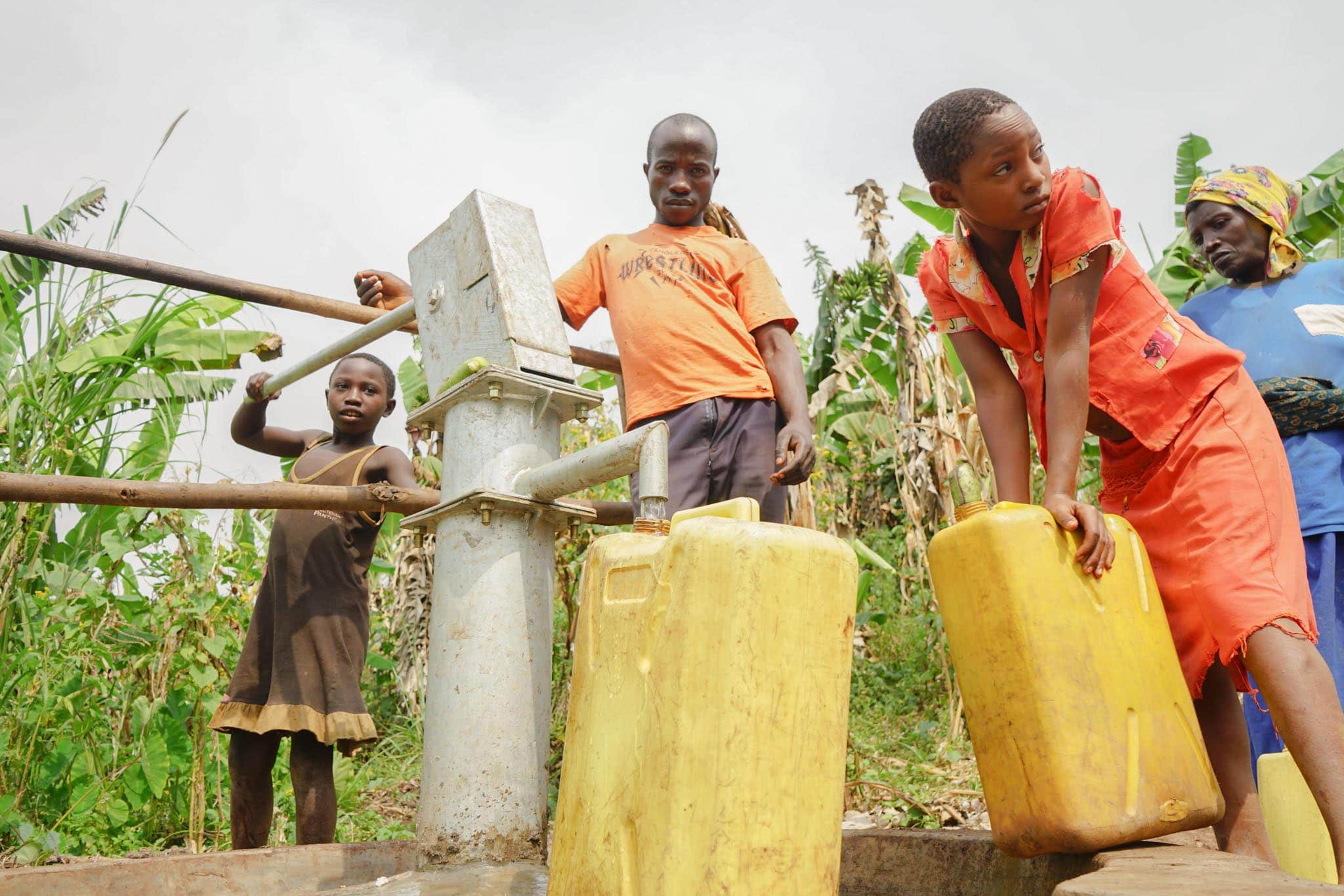 Rukiri B Village members fetching water from the newly constructed well as part of Raising The Village programs.