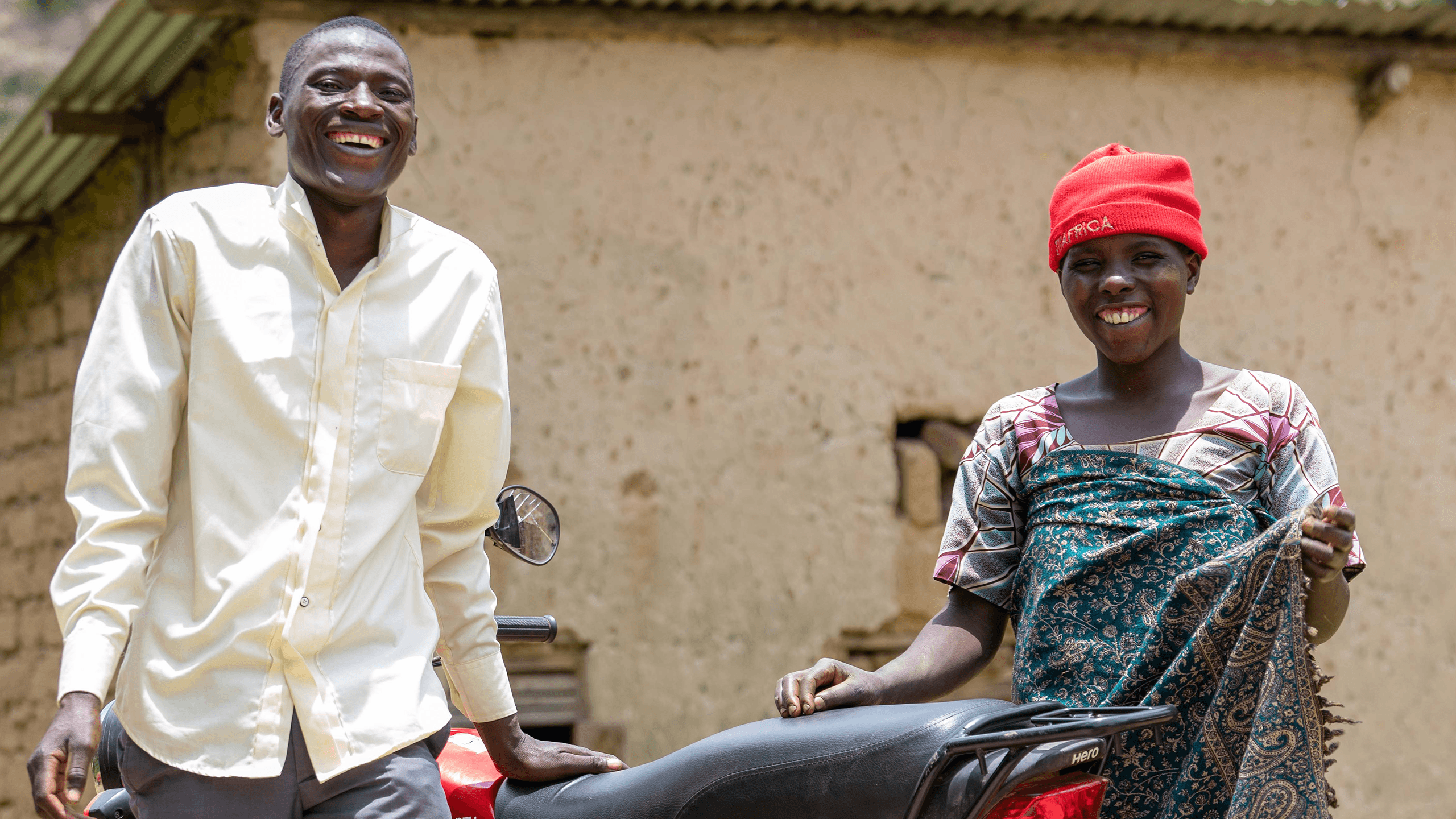 Jovia smiles with Kadogo, the motorbike driver who saved her life.