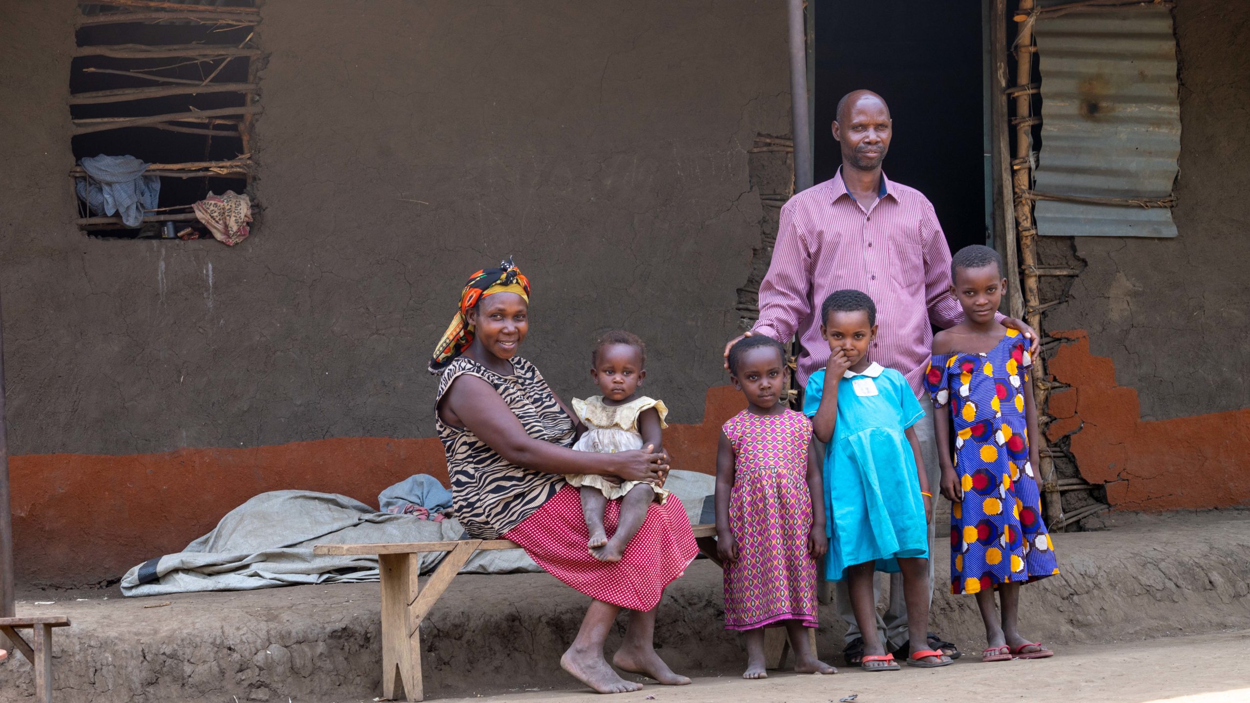 Aisha, her husband (Thomas) and their children at their home in Kabukanga, Kagadi district.