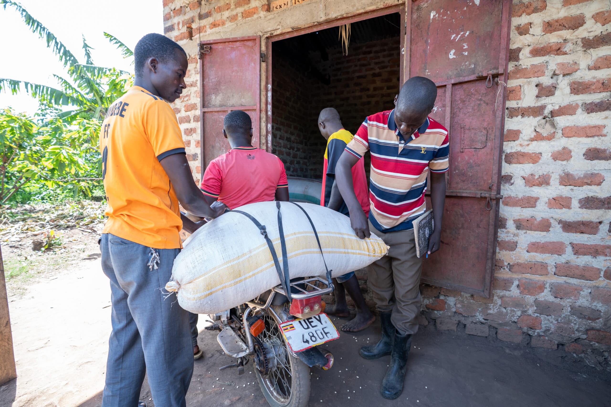 A member brings their produce to the storage center.