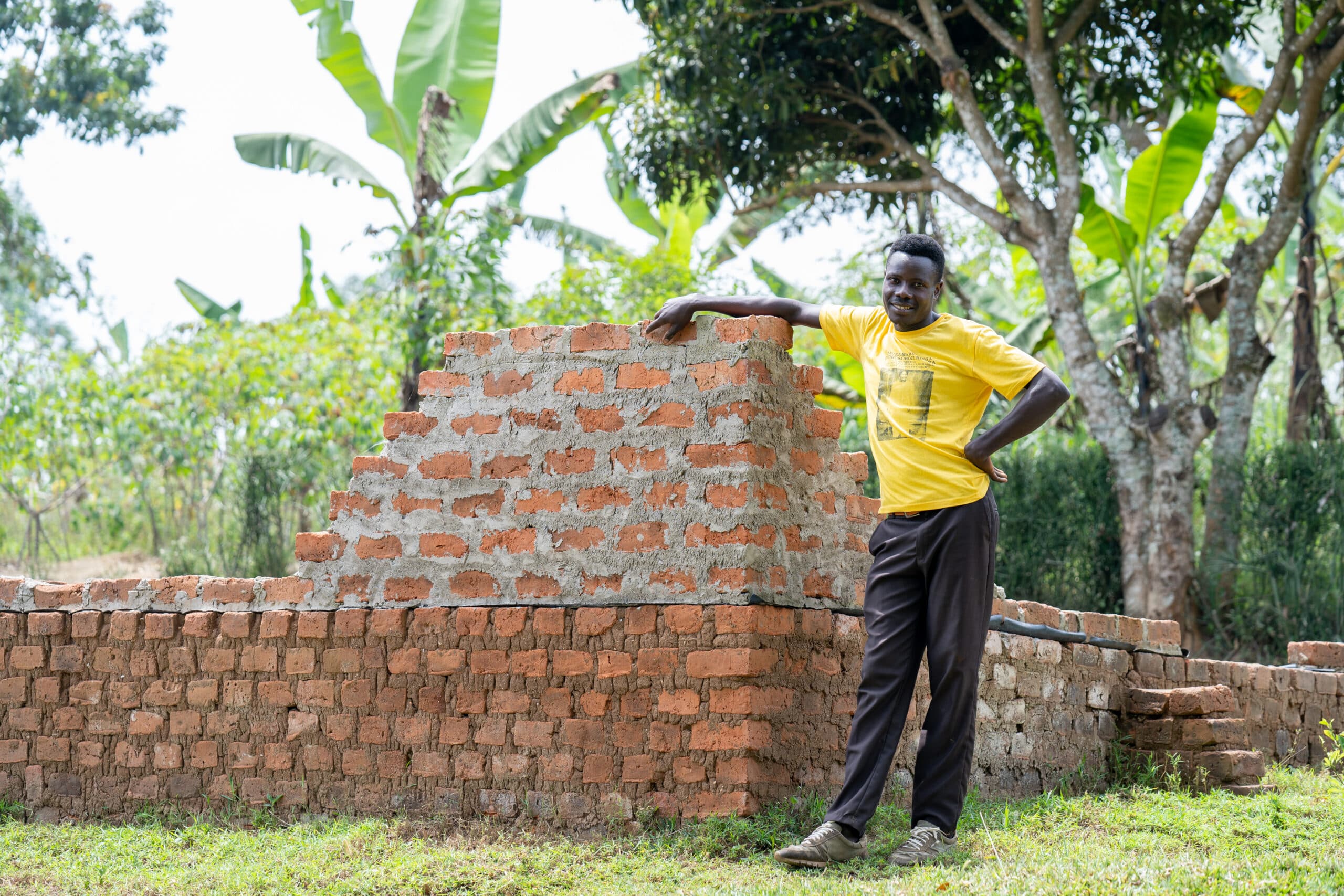 The new home Busobozi is constructing with his improved income and savings.