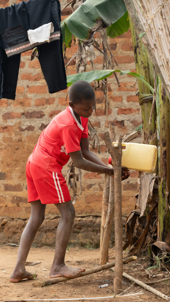 Sharon’s son using the tippy tap